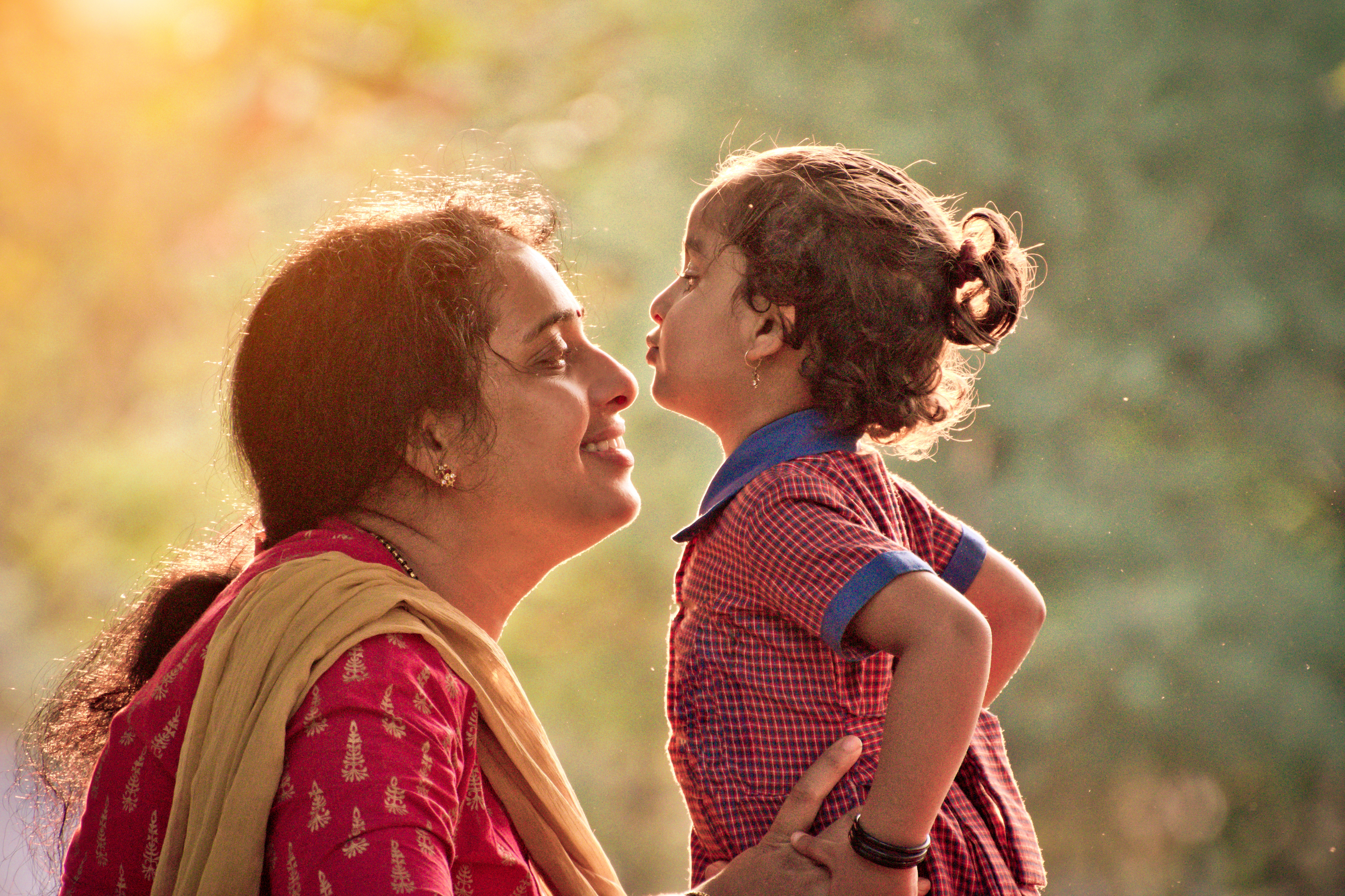 Indian parents playing with their child