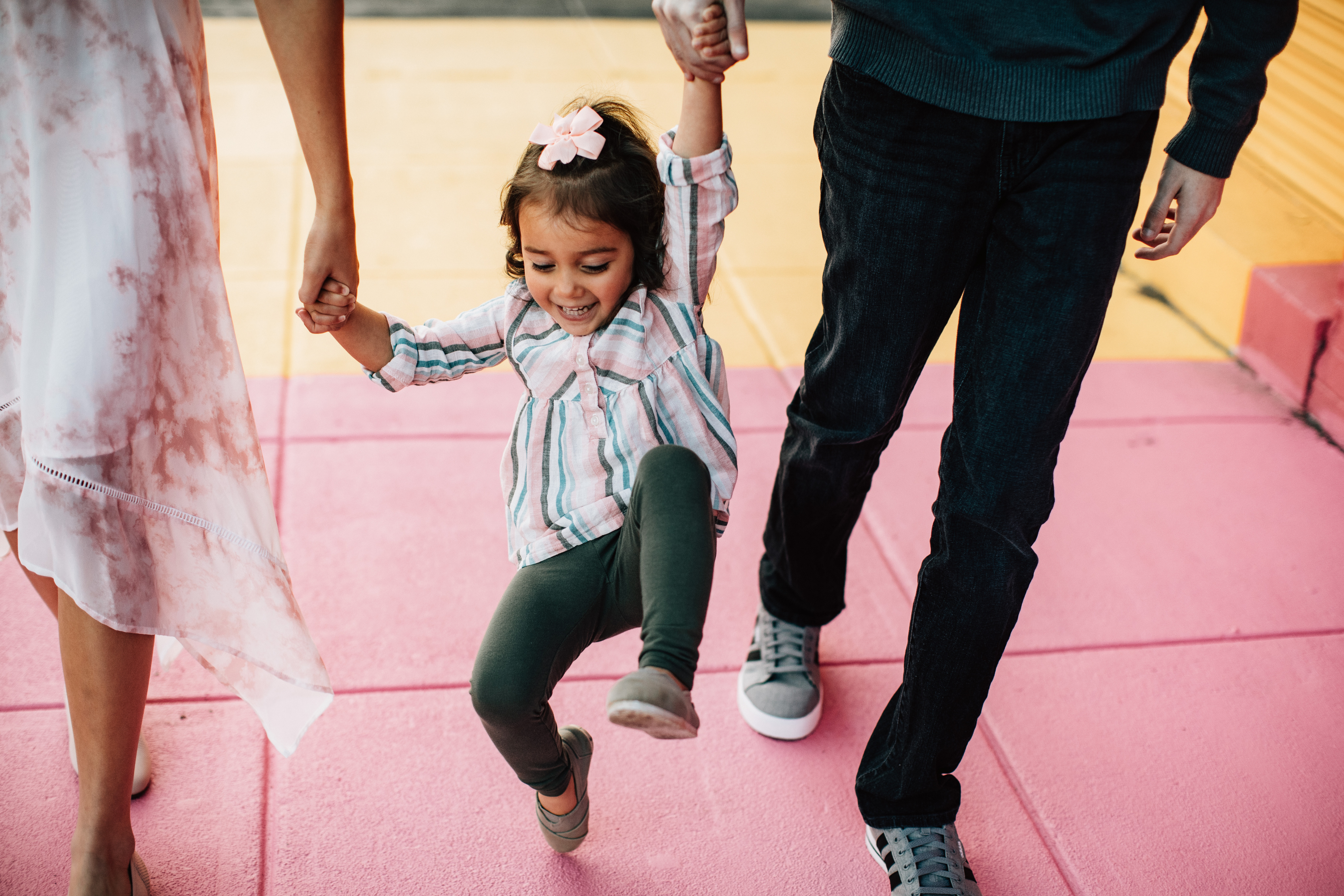 Indian parents playing with their child